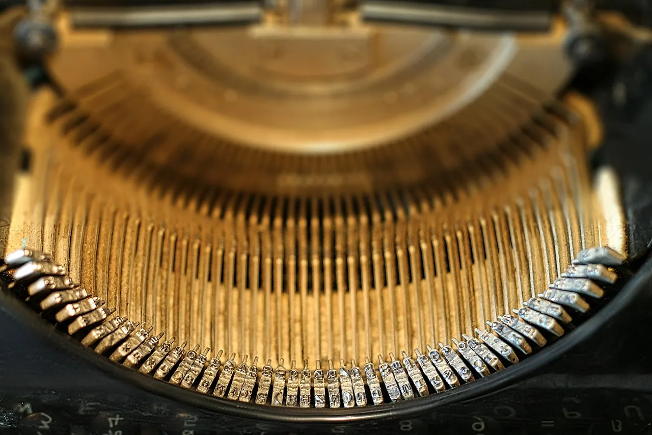 Close-up of the round metal keys of a vintage typewriter